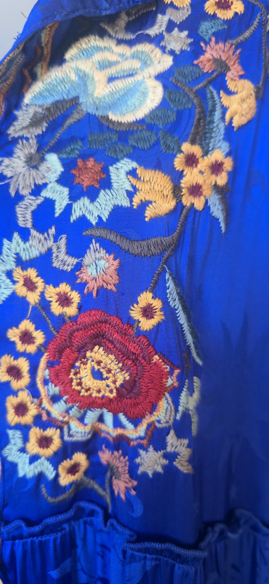 Floral embroidery detail on bodice