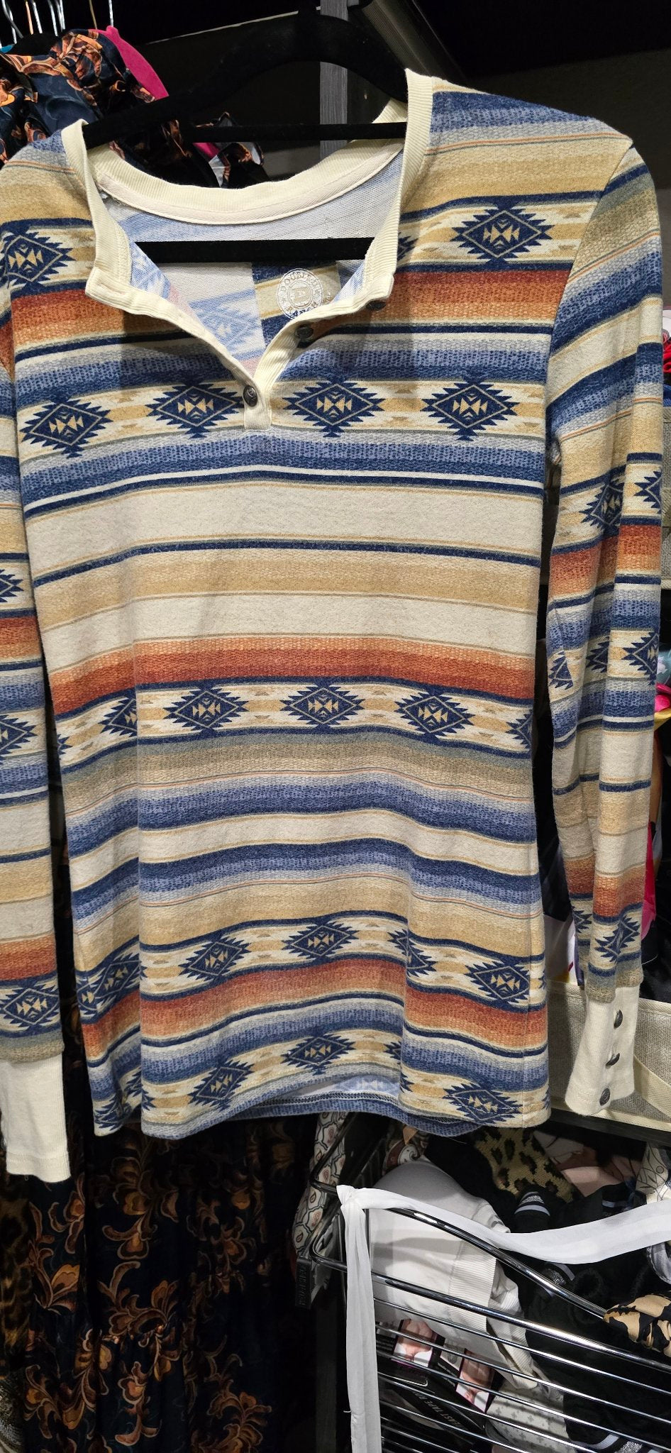 Double D Ranch Cow Camp Henley with horizontal stripes and geometric diamond motifs in beige, blue, and terracotta, detail view