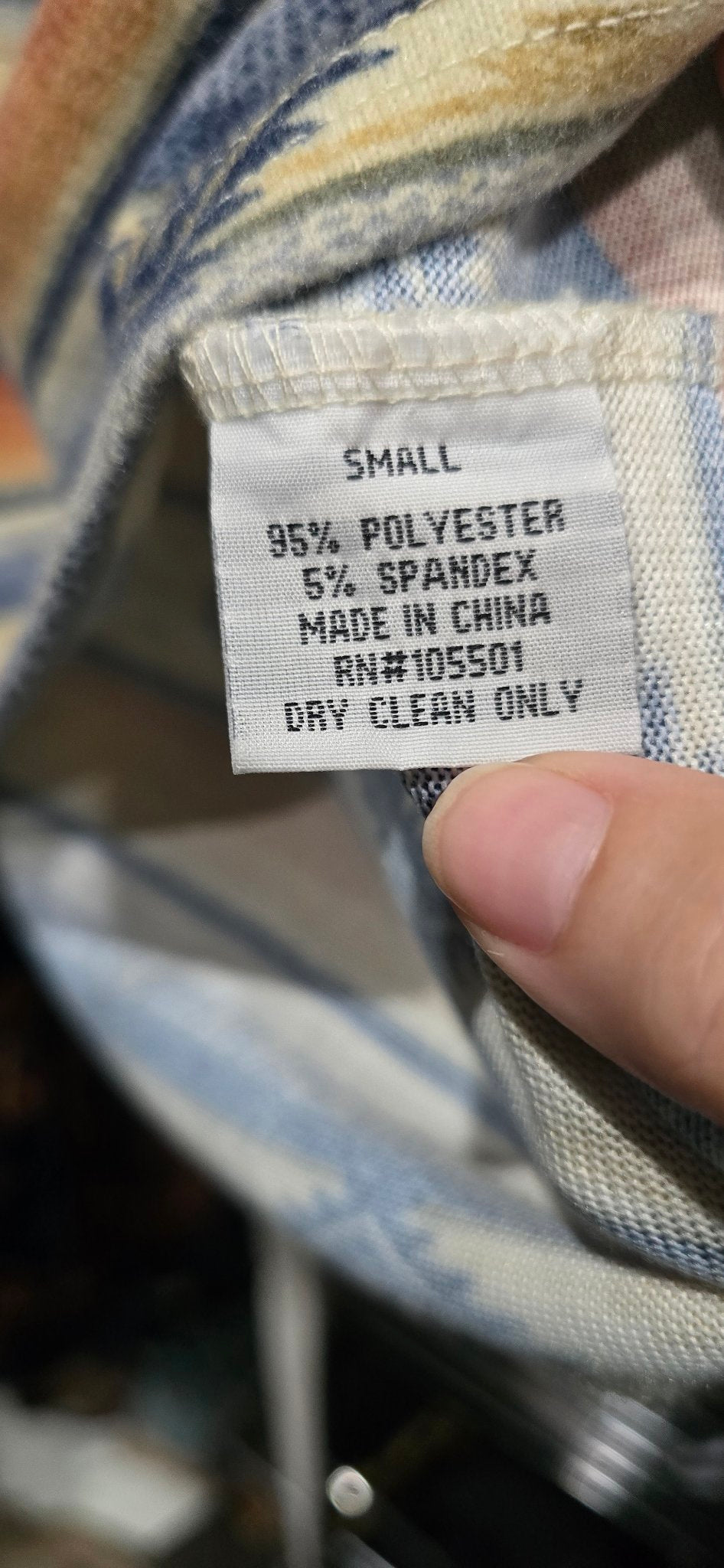Size and material label inside the Double D Ranch Cow Camp Henley reading Small, 95 percent polyester 5 percent spandex, Made in China