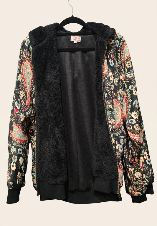 Inside view of the Cienna Designs black floral bomber jacket showing black sherpa fleece lining