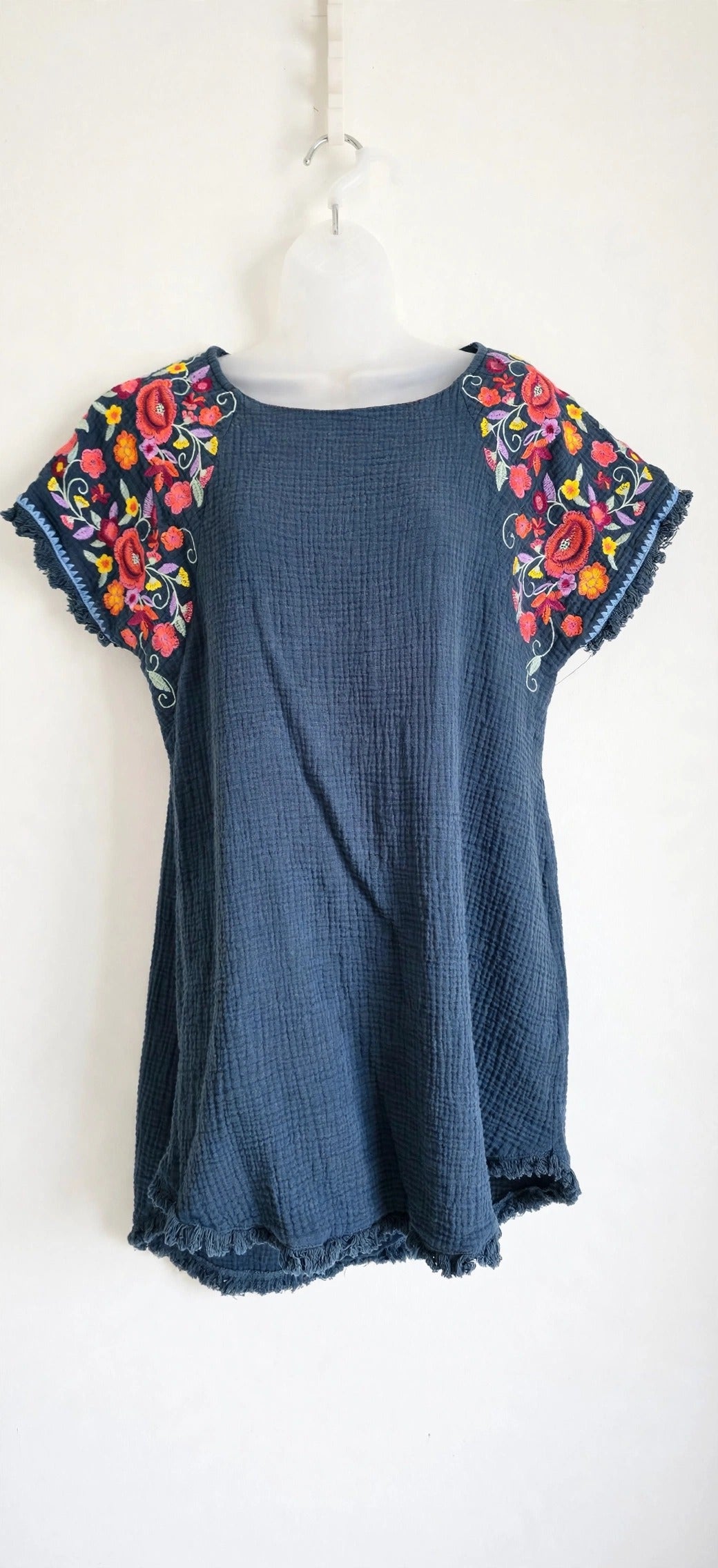 Umgee dusty navy blue embroidered hi-lo mini dress with colorful floral embroidery on the shoulders, front view, size S